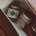 Two jars of 'The Living Base' product in a leather-bound box.